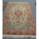 Ghom rug, Central Persia, the ivory field of floral vines around a pole medallion framed by ice blue