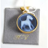 A 9ct gold diamond and hardstone cameo pendant, carved as a terrier on an onyx backing, measures 2.