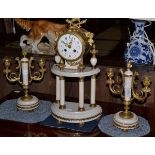 A marble and gilt metal mounted striking mantel clock with garniture, early 20th century, portico