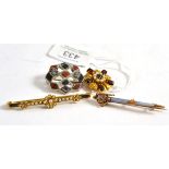 Four brooches including a hardstone set dirk brooch, a seed pearl floral bar brooch, a hardstone
