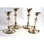 Set of four silver candlesticks, 24cm high