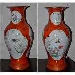 A pair of Oriental orange ground vases of recent date, 47cm high