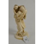 A Japanese ivory okimono of a fisherman and child, height 18cm