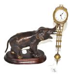 A bronzed elephant 'mystery' timepiece, Junghans, circa 1910, elephant raised upon a wooden base,