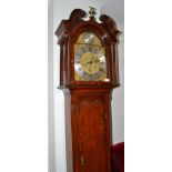 An oak centre seconds longcase clock with bolt and shutter maintaining power, signed Jno Skirving,