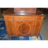 # A late 19th century mahogany, satinwood banded and ebony strung side cabinet, the long frieze