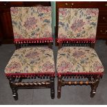 Eight English joined oak dining chairs, later recovered in floral fabric with turned supports