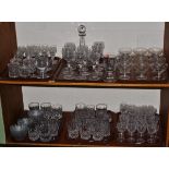 Two shelves of glass including Stuart drinking glasses, tumblers, etc