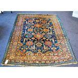 Kuba rug, North East Caucasus, the indigo field of stylised flowerhead enclosed by Kufic borders,