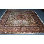 Tabriz carpet of square form, Persian Azerbaijan, the ivory field of scrolling vines centred by a