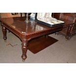 Mahogany dining table with two leaves