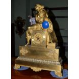 An ormolu striking figural mantel clock, circa 1850, surmounted with a reclining figure, base