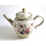 An early 19th century famille rose teapot and cover, 17cm high