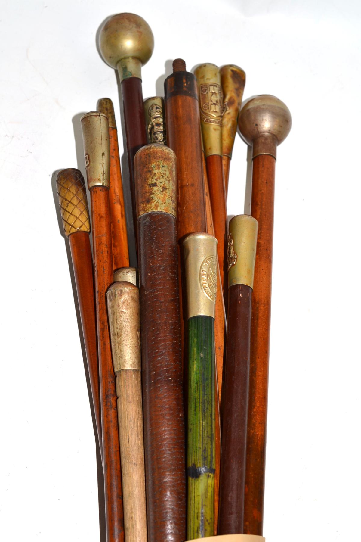 Bundle of assorted batons including The Irish Guard, Royal Scots, East Lancashire, RFC etc