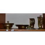 Collection of 18th and 19th century brassware including bleeding bowl, two candlesticks, lion mask