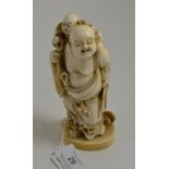 A 19th century Japanese Meiji period carving of Hotei (loose based), 15cm high