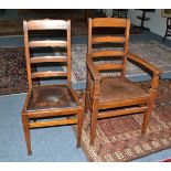 A set of eight (6+2) Arts & Crafts oak ladder back dining chairs, stamped Rd No, 564245, armchair