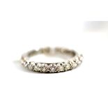 An 18ct white gold diamond full eternity ring, round brilliant cut diamonds in a claw setting, total