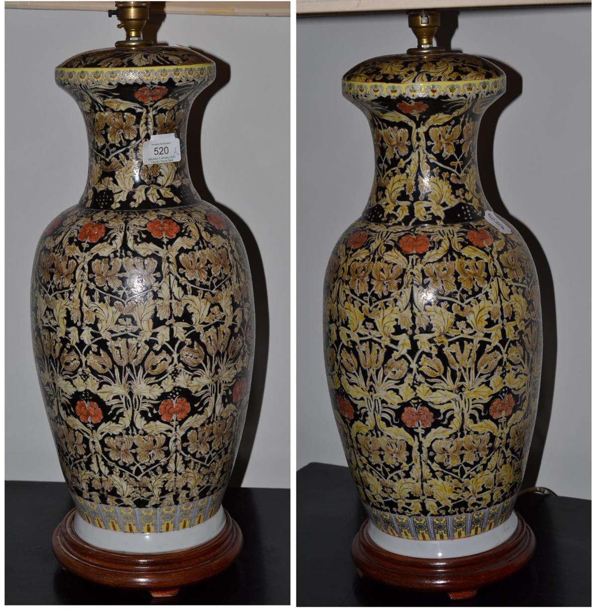 A pair of Chinese polychrome decorated table lamps, 83cm high including shade and a blue and white