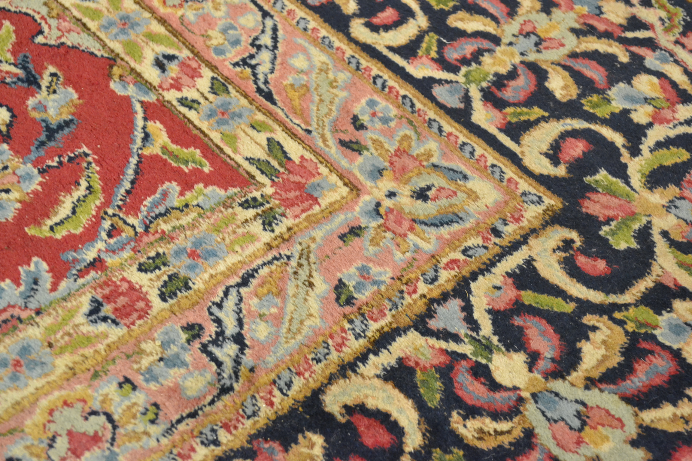 Kirman carpet, South East Persia, the raspberry field of scrolling vines around a floral medallion - Image 7 of 7