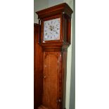 An oak thirty hour longcase clock, circa 1800, flat top pediment, 12-inch painted dial, date dial,