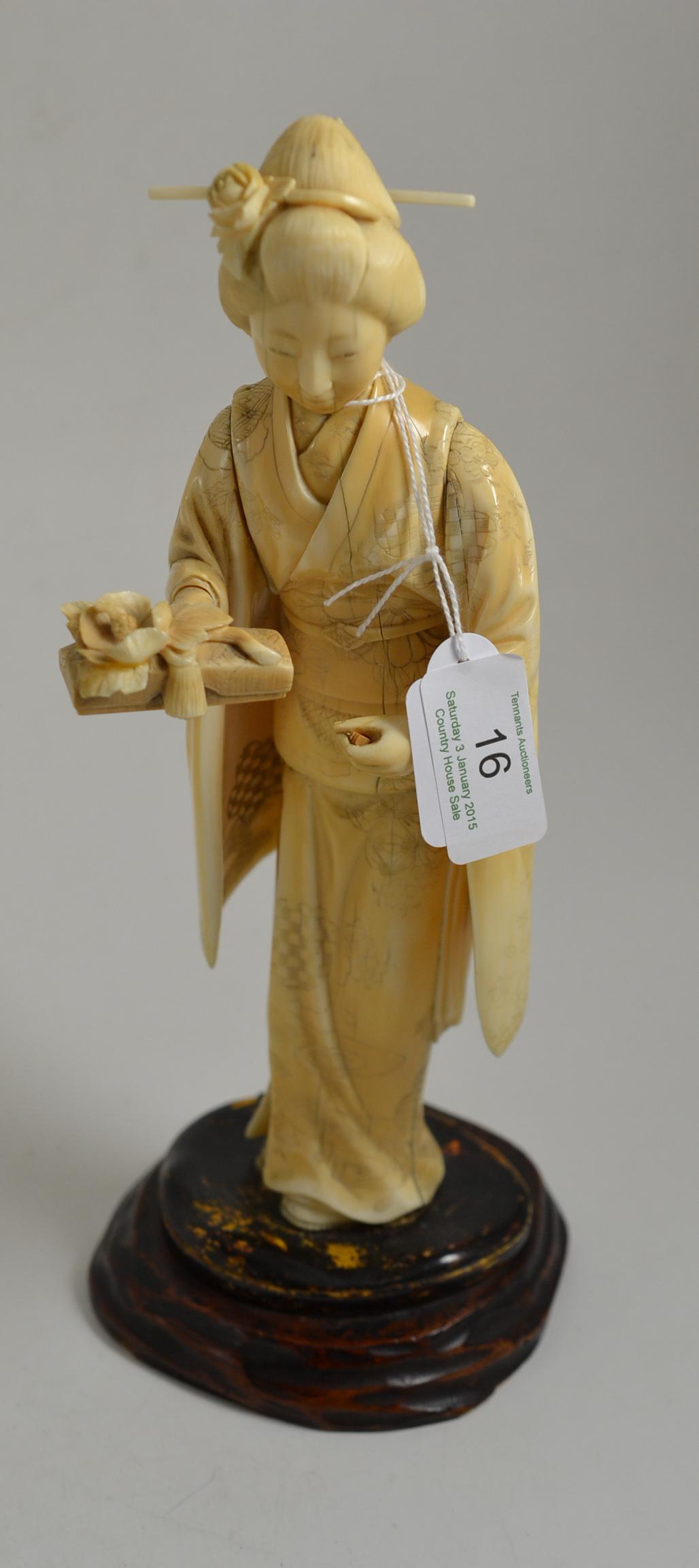 ^ A late 19th century Japanese ivory figure, 28cm high