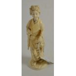 A 19th century Japanese Meiji period carving of Bijin holding a fan, 18cm high