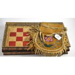 A North American beadwork tobacco pouch and a English games board modelled as two books (2)