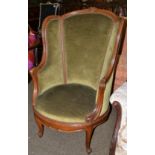 ^ An early 20th century Continental oak framed armchair with four scatter cushions