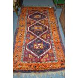 Yuruk rug, East Anatolia, the field with three linked stepped medallions enclosed by mustard