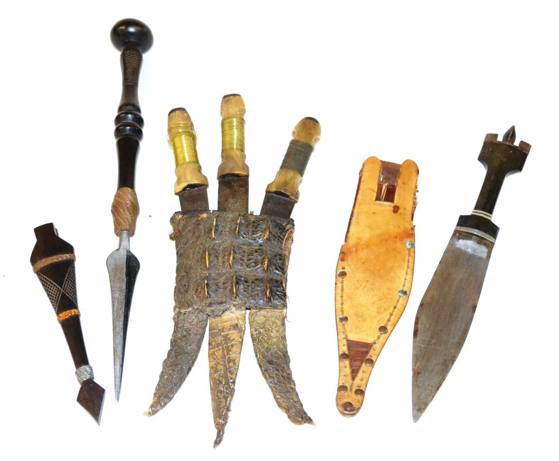 A Set of Three Sudanese Daggers, each with Thuluth script inlaid steel blade, brass wire bound