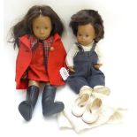 Sasha Doll with brown wig and eyes, wearing a red cotton dress, tartan jacket and red felt coat with