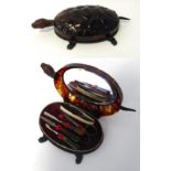 Circa 1930's Faux Tortoiseshell Manicure Set Modelled as a Tortoise, with a hinged cover enclosing a