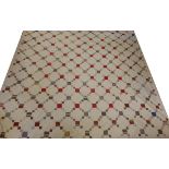 Large 19th Century Patchwork Quilt, with a chequered design on a cream ground with a pink printed