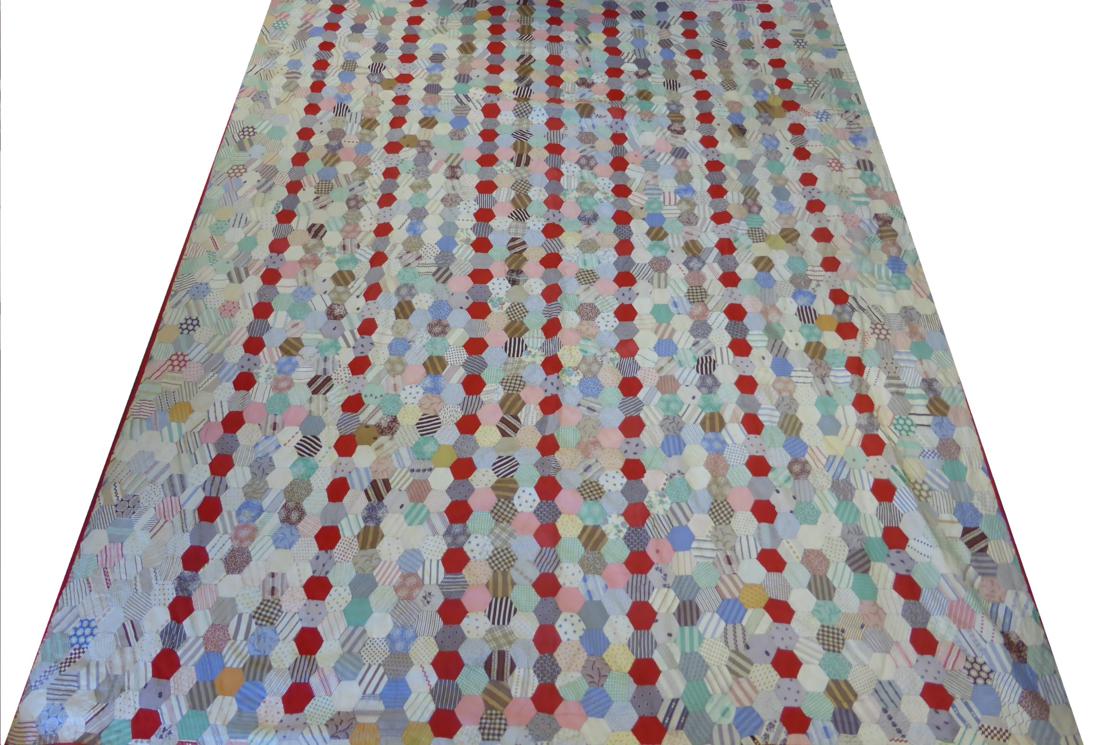 Large Late 19th Century Patchwork Quilt with a red cotton trim, 220cm by 270cm