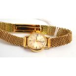 A lady's 9ct gold wristwatch, signed Omega, with attached 9ct gold bracelet