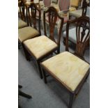 A set of four George III style dining chairs