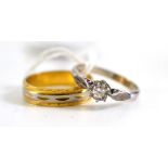 An 18ct two colour gold band ring and a diamond solitaire ring, estimated diamond weight 0.25