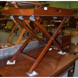 A mahogany butler's tray on stand