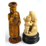 A 19th century Indian carved ivory group and another figure