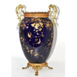 A French earthenware vase with gilt decoration on a blue ground with gilt metal mounts