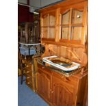 A pine kitchen dresser, assorted mirrors, pine dressing table, coffee table, dining chair,