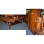 A walnut triple door wardrobe, bedside cupboard, walnut cased radio, tin bath, leather footstool,