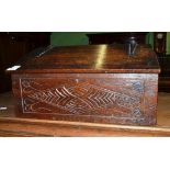 A carved oak bible box