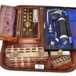 Cased ophthalmoscope, four suppository moulds and cased Sike's hydrometer