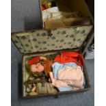 A 19th century stained pine box containing two dolls (a.f.) and a box of assorted linen and