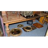 A late Victorian carved oak extending dining table with additional leaves