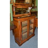 A Victorian figured walnut pier cabinet with superstructure back