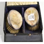 Pair of silver backed brushes (cased)