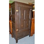 A carved oak food cupboard